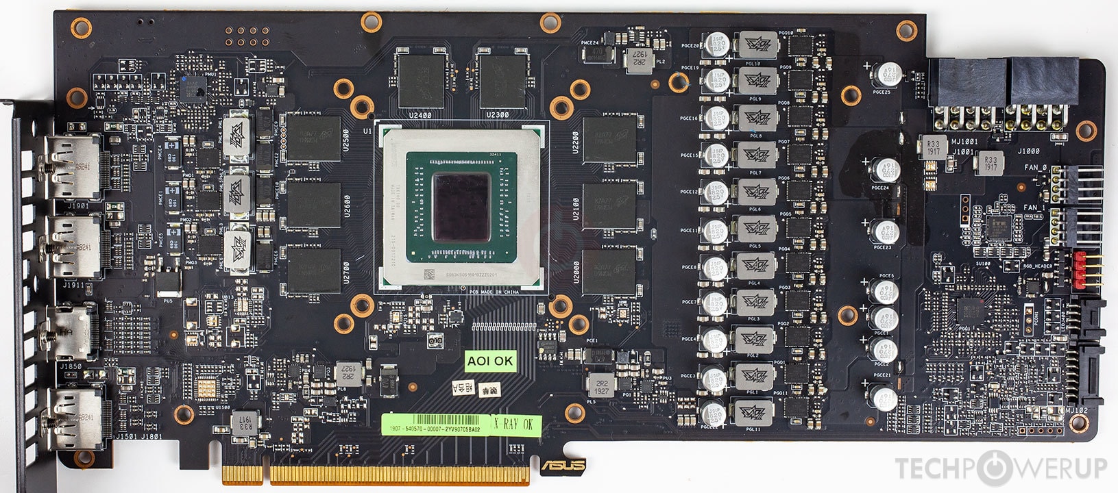 Une carte mère Asus avec de nombreux composants visibles, dont six ports HDMI.